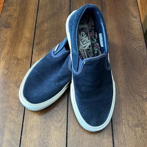 Navy blue suede Vans slip-ons